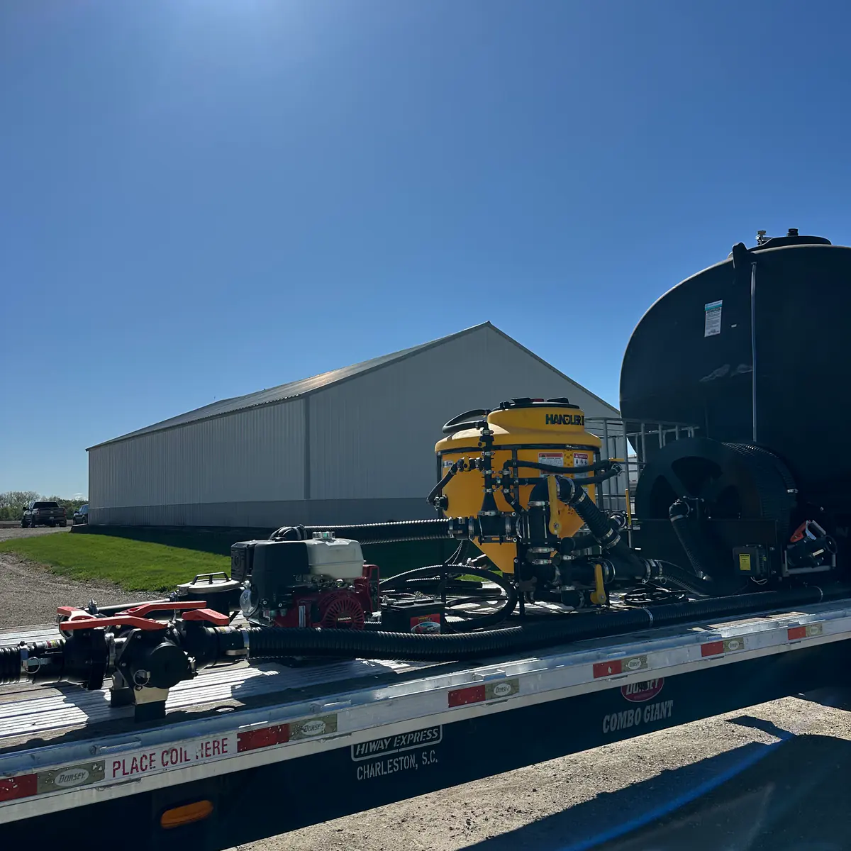 Transfer pump and cam-lock plumbing station mounted on a custom nurse trailer from Dahl Farm Supply