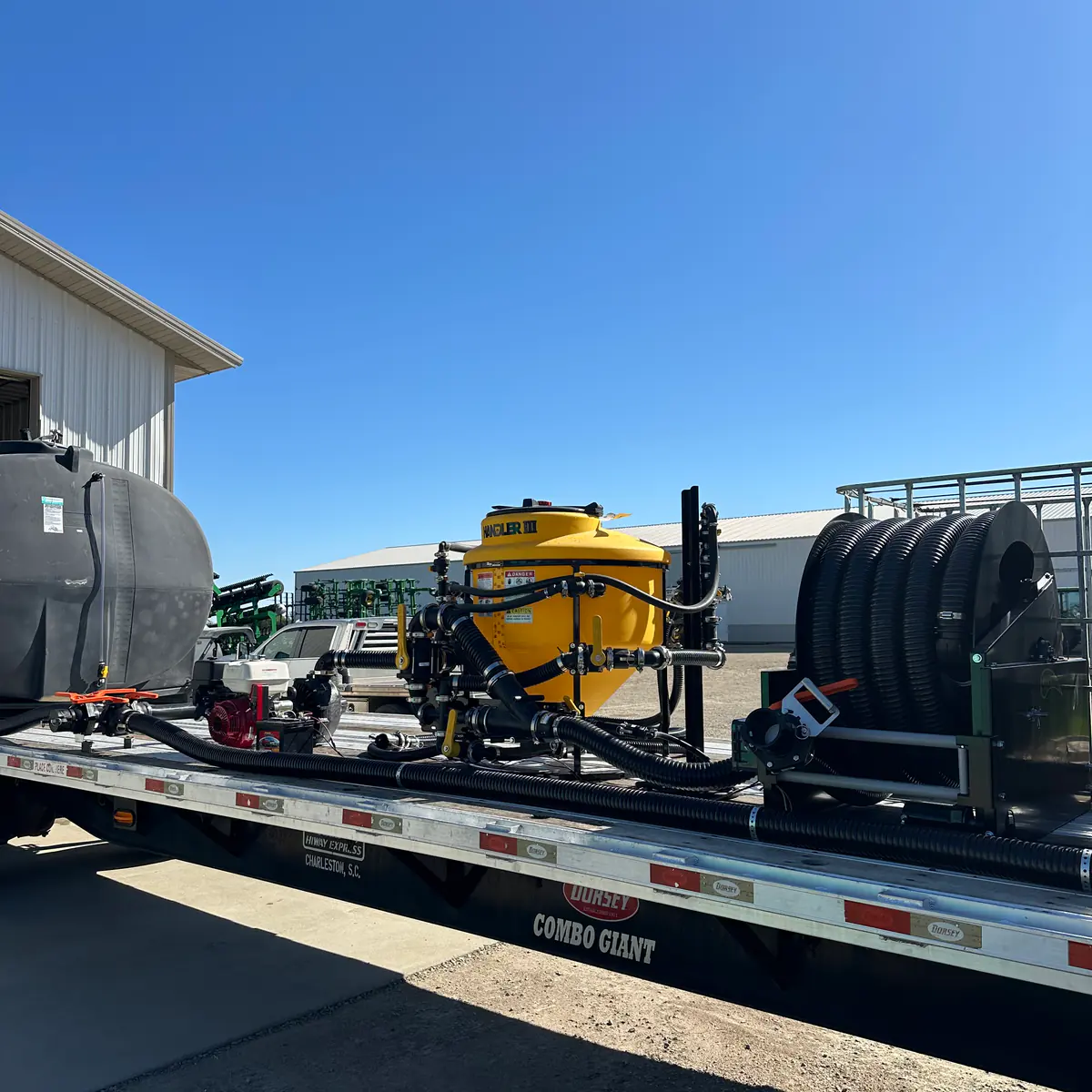 Nurse trailer transfer station with a yellow centrifugal pump and Honda engine on a Dahl Farm Supply custom build